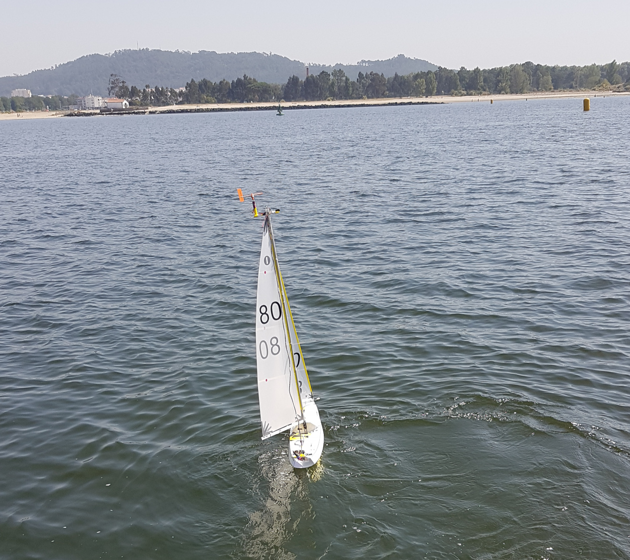 A small sailing boat in the water